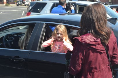 Lemoore Chamber of Commerce Executive Director Amy Ward had lunch with daughter Jaylin while a television news crew captured the mood of Friday's Car Picnic.